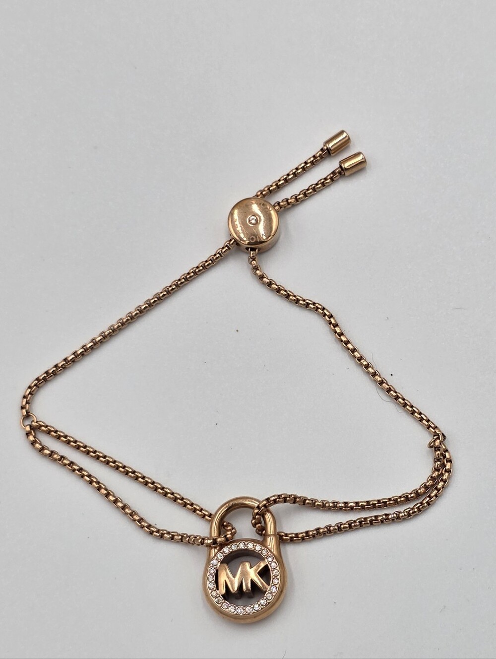 Michael Kors Rose Gold Tone Pave Crystal MK Padlock Double Chain Slider Bracelet